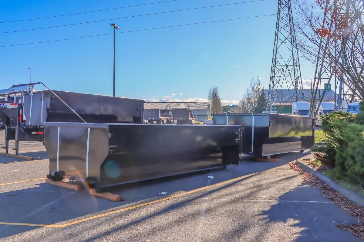 Roll-off dumpster ready for waste disposal at job site for Yard Waste Dumpster Rental in Old Lyme